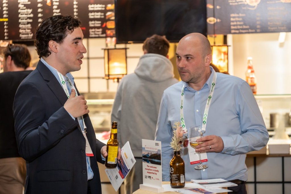 Conversation at an exhibition booth at the Swiss Biotech Day 2026
