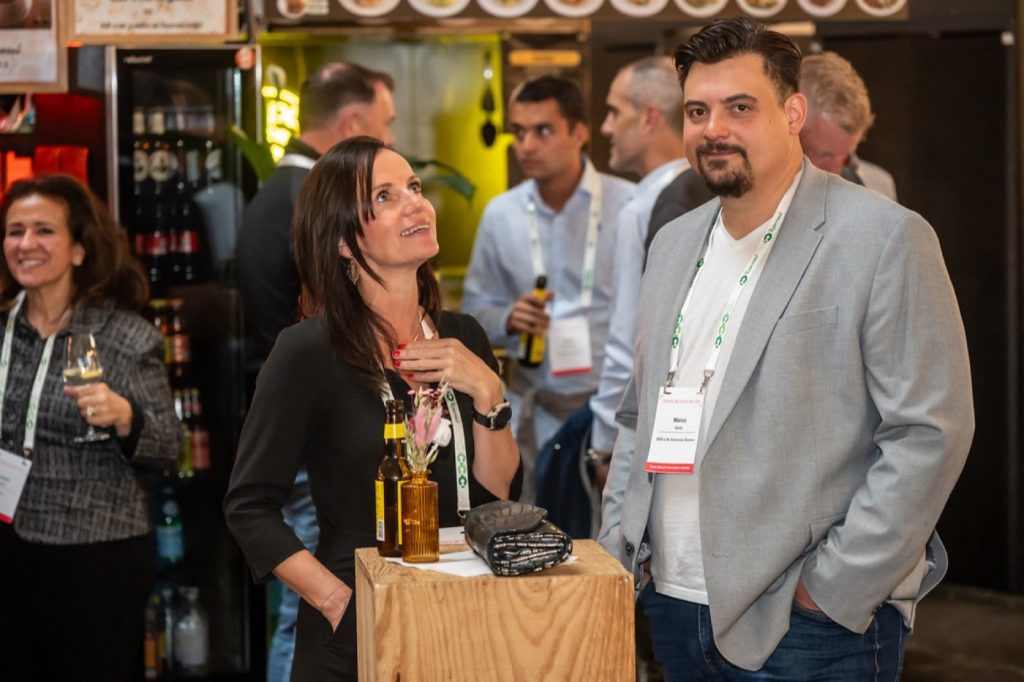 Three delegates at an exhibition booth