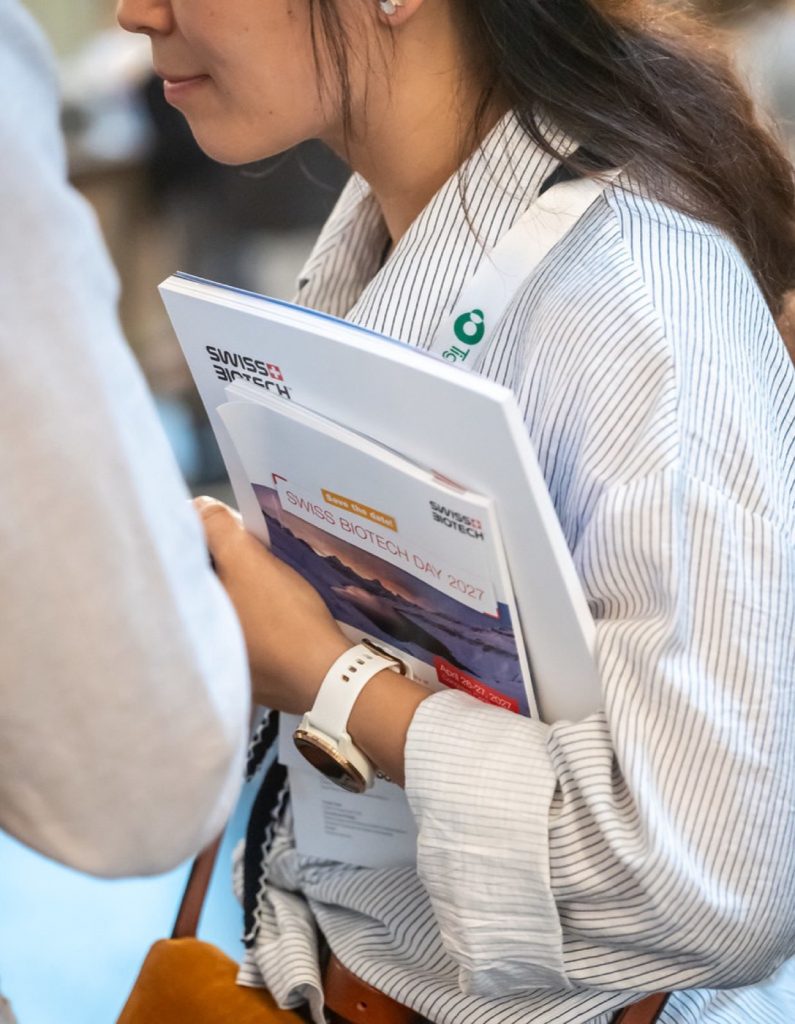 Delegate reading the conference guide