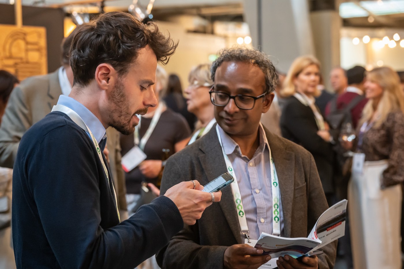 Two investors in conversation at the Swiss Biotech Day 2026